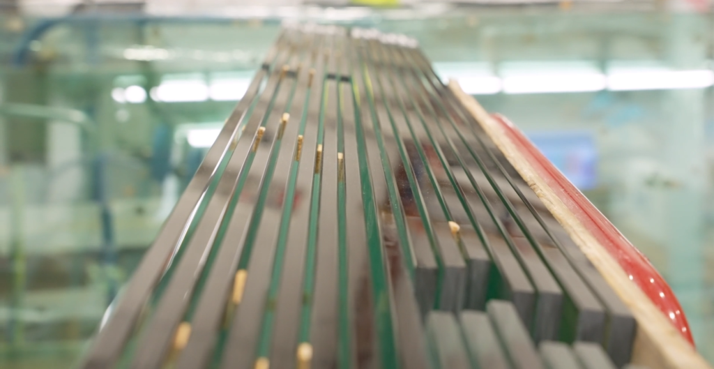 Glass stacked using cork spacers to prevent breakage and promote safety.